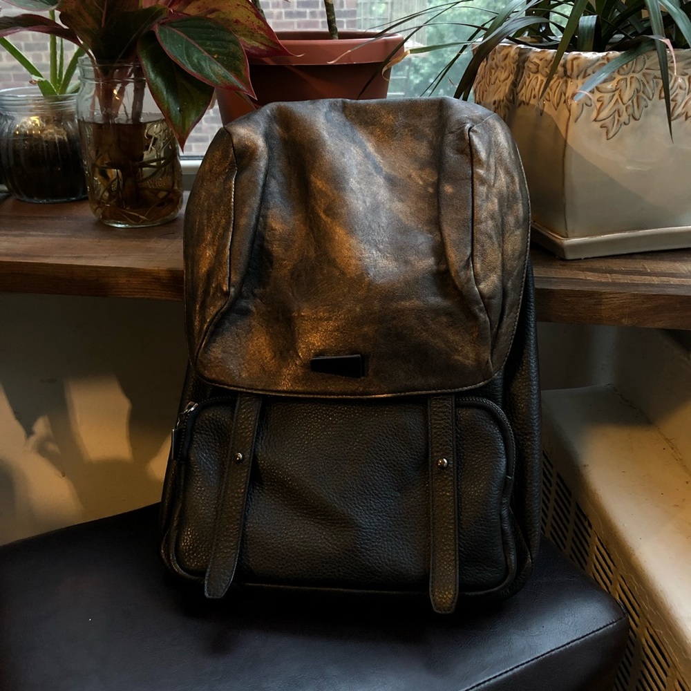 Black and bronze leather backpack